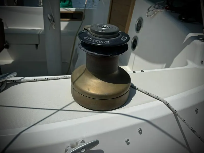 Slide: The Image of Bronze winch on 1982 Pearson Ketch sailboat deck. - 10