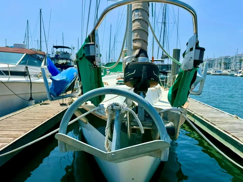 Slide: The Image of 1982 Pearson Ketch sailboat docked in marina, front view. - 2
