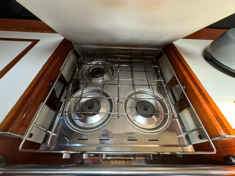 Slide: The Image of Stove in 1982 Pearson Ketch sailboat galley with three burners. - 46