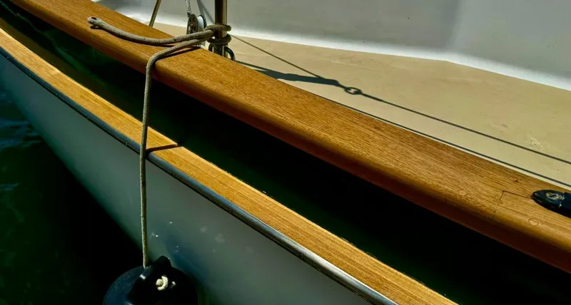 Slide: The Image of Close-up of 1982 Pearson Ketch sailboat with wooden deck detail. - 6