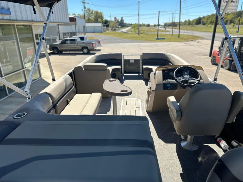 Slide: The Image of 2025 Bennington 22 SXS APG pontoon boat interior with seating and steering console. - 4