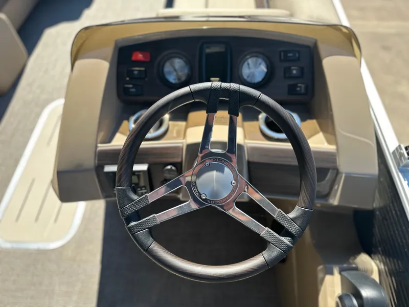Slide: The Image of Steering wheel and dashboard of 2025 Bennington 22 SXS APG boat. - 5