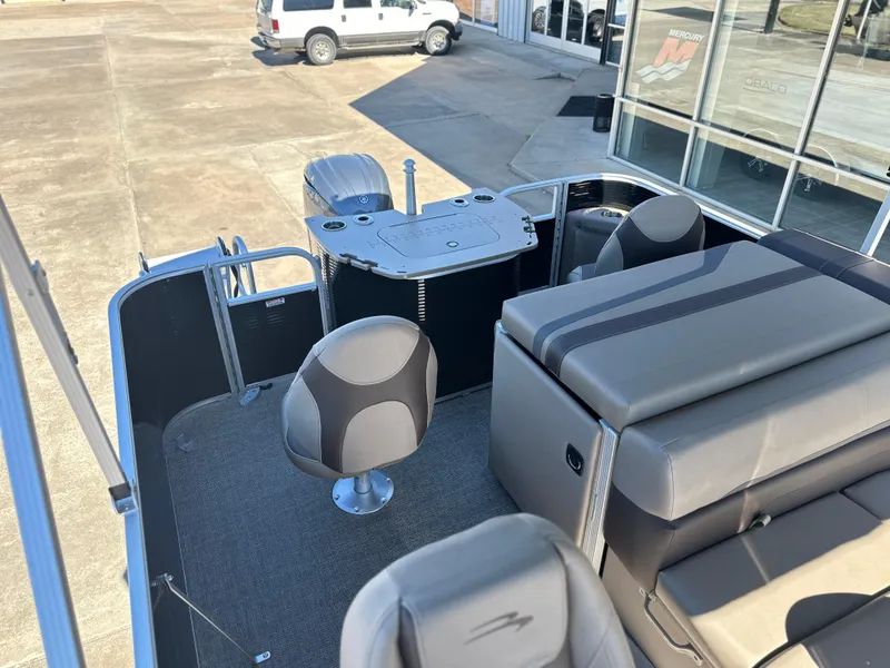 Slide: The Image of 2025 Bennington 22 SXS APG pontoon boat interior with seating and helm station. - 8