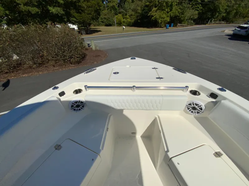 Slide: The Image of 2025 Cobia 240 Center Console boat, spacious deck with seating and storage. - 10