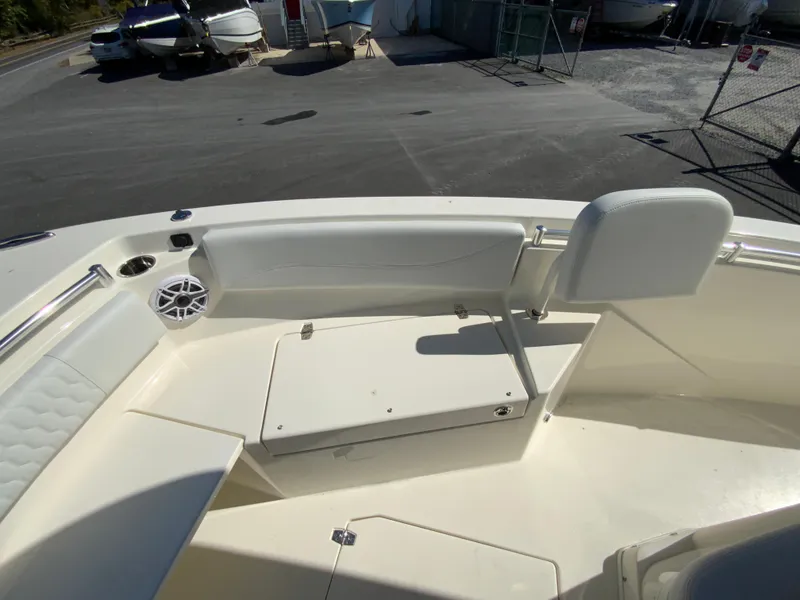 Slide: The Image of 2025 Cobia 240 Center Console boat interior with seating and storage. - 12