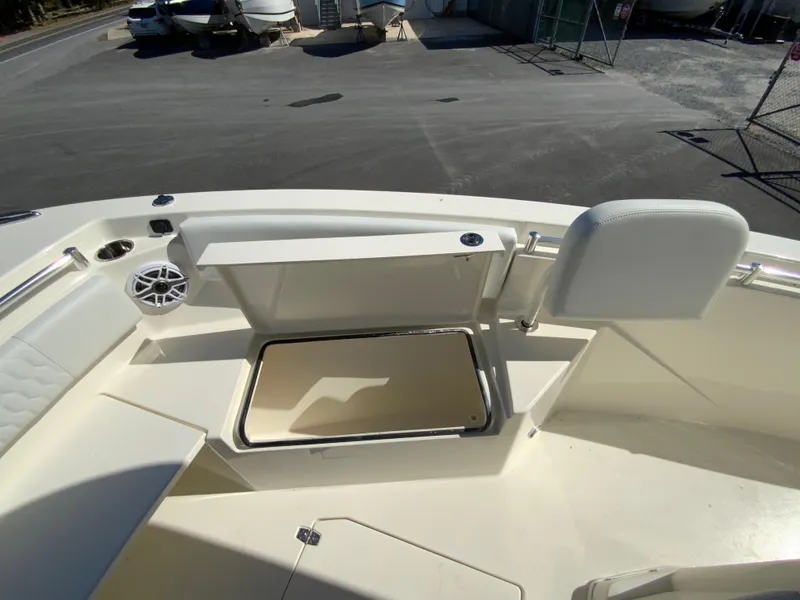 Slide: The Image of 2025 Cobia 240 Center Console boat interior with open storage compartment. - 13