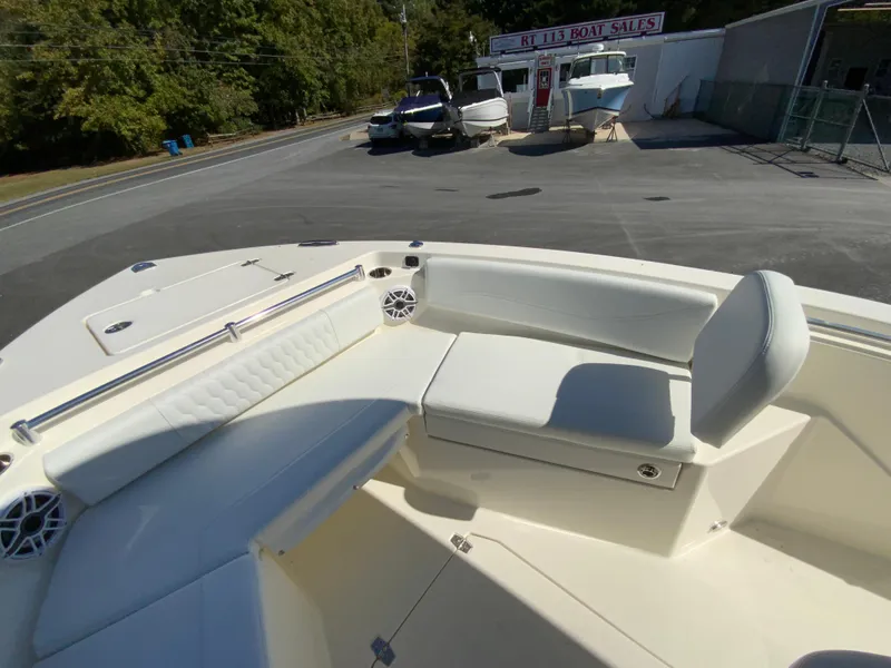 Slide: The Image of 2025 Cobia 240 Center Console boat with spacious seating at a boat sales lot. - 15