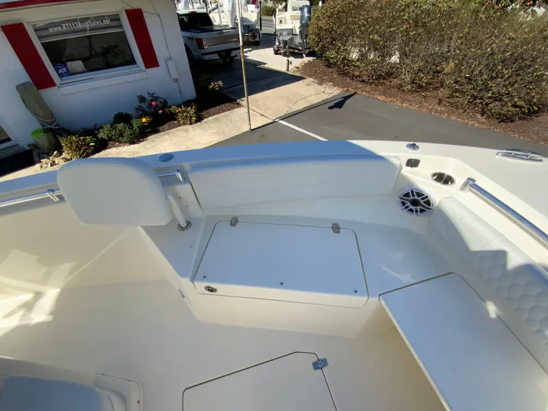 Slide: The Image of 2025 Cobia 240 Center Console boat interior with seating and storage. - 16