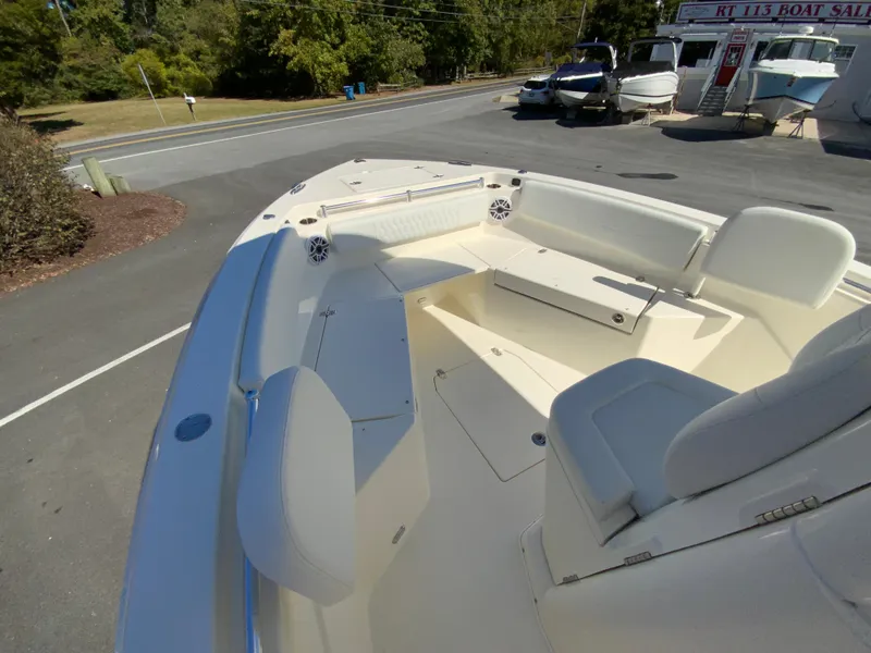 Slide: The Image of 2025 Cobia 240 Center Console boat interior with seating and storage. - 18