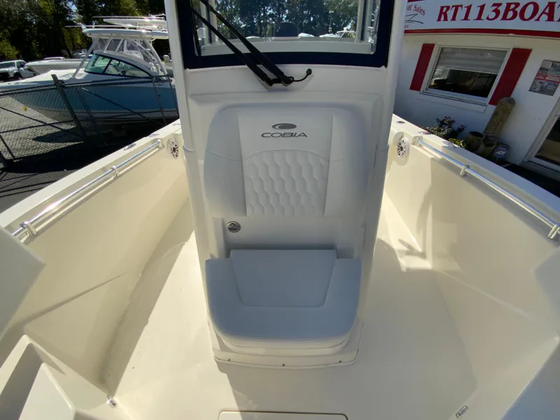 Slide: The Image of 2025 Cobia 240 Center Console boat interior with seating and console view. - 20