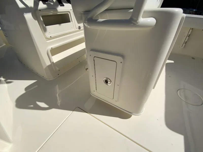Slide: The Image of 2025 Cobia 240 Center Console boat interior with storage compartment. - 26
