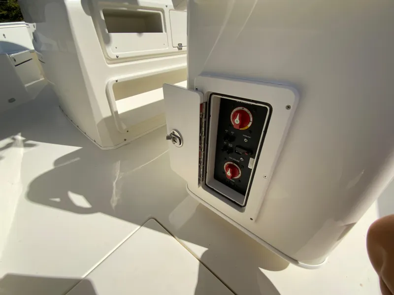 Slide: The Image of 2025 Cobia 240 Center Console boat with open control panel. - 27