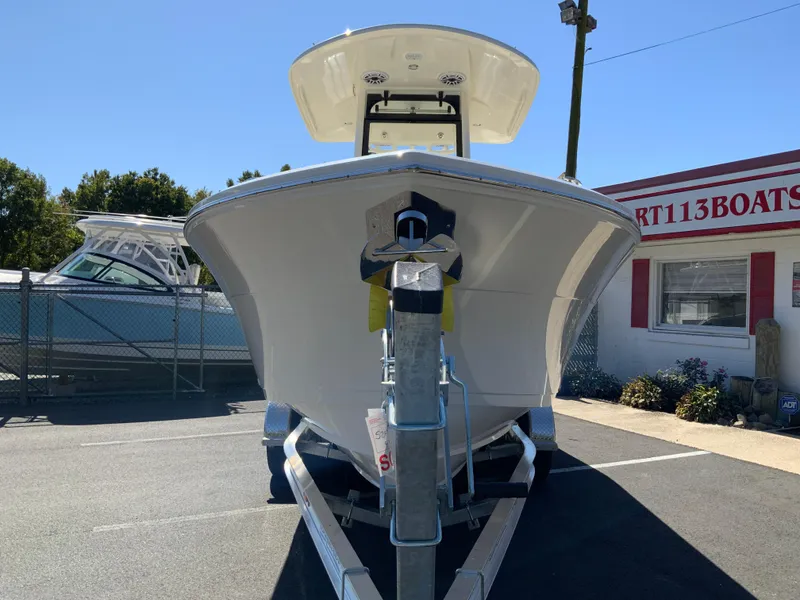 Slide: The Image of 2025 Cobia 240 Center Console boat on trailer at dealership. - 3