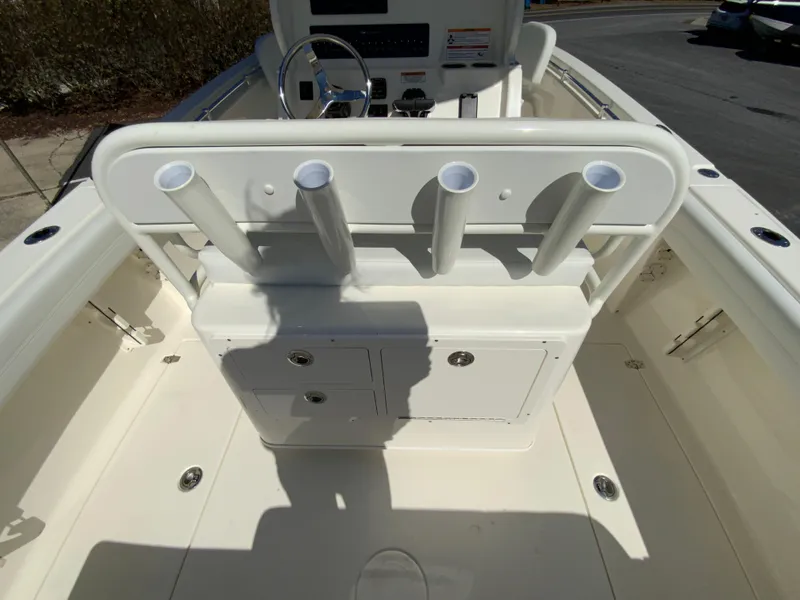 Slide: The Image of 2025 Cobia 240 Center Console boat interior with rod holders and storage compartments. - 30