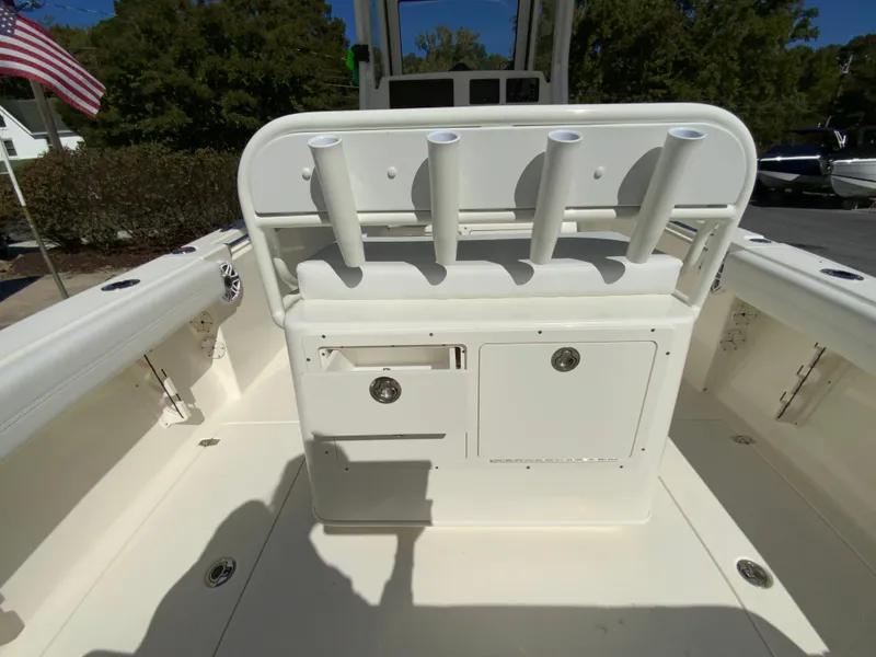 Slide: The Image of 2025 Cobia 240 Center Console boat interior with rod holders and storage compartments. - 31