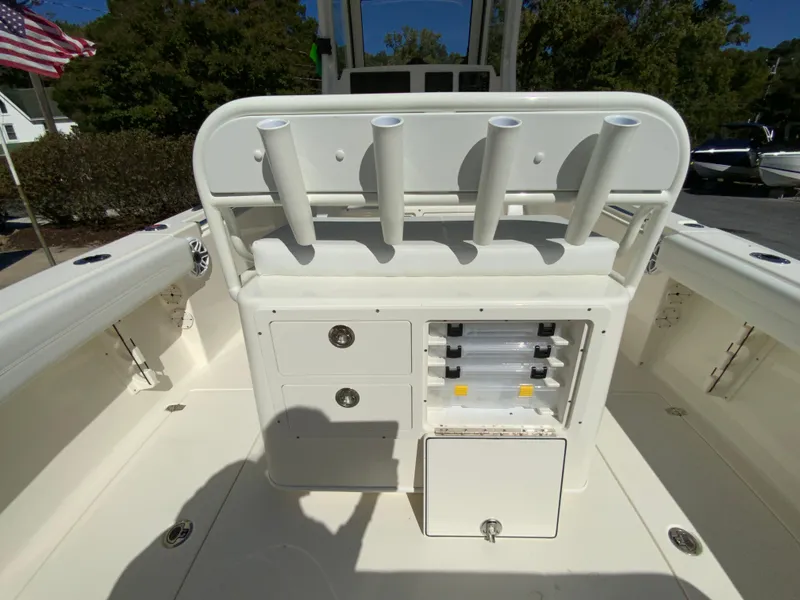Slide: The Image of 2025 Cobia 240 Center Console boat interior with rod holders and storage compartments. - 33