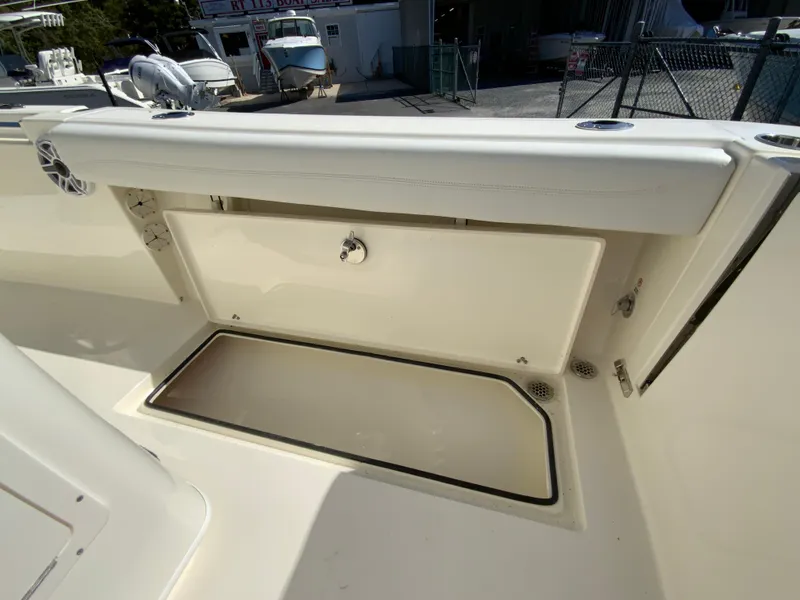 Slide: The Image of 2025 Cobia 240 Center Console boat storage compartment, open and spacious design. - 35
