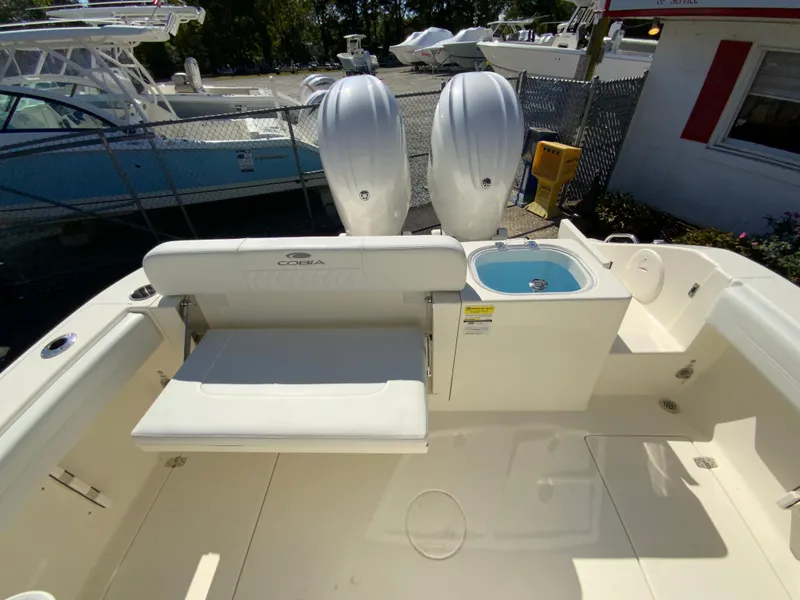 Slide: The Image of 2025 Cobia 240 Center Console boat interior with seating and dual engines. - 39