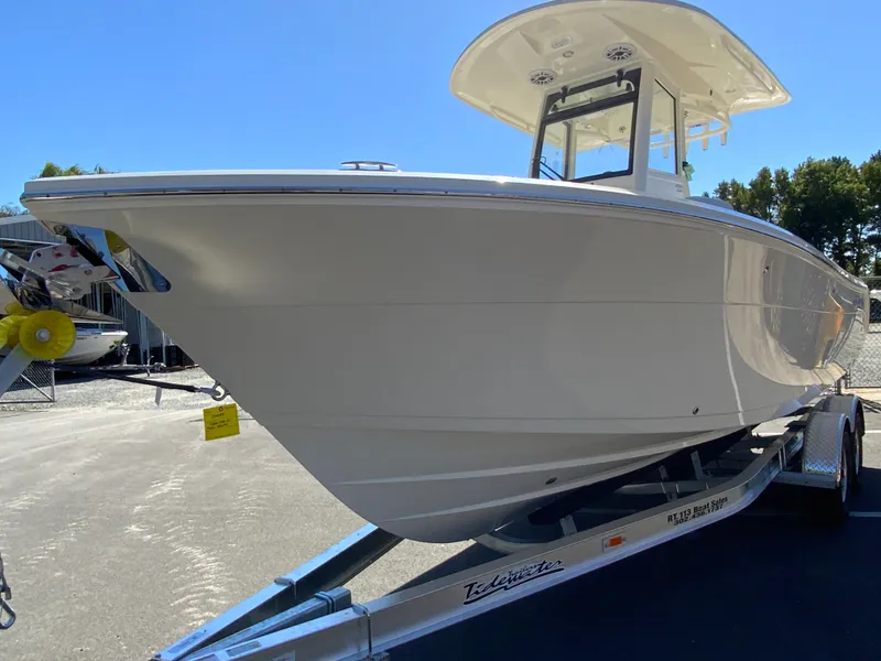 Slide: The Image of 2025 Cobia 240 Center Console boat on trailer, side view. - 4