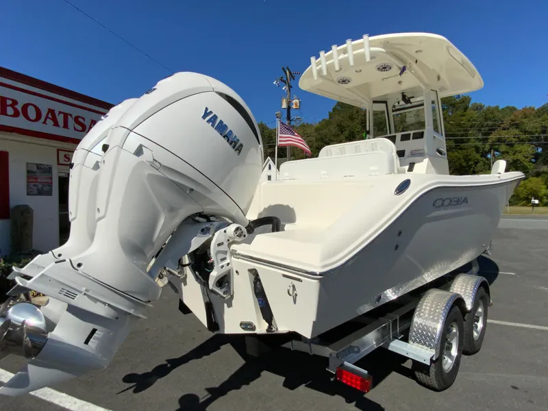 Slide: The Image of 2025 Cobia 240 Center Console boat with Yamaha engine on trailer. - 7