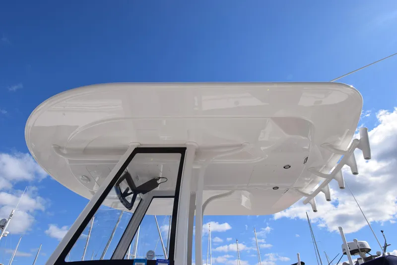Slide: The Image of Regulator 25FS 2022 boat canopy against a clear blue sky. - 19