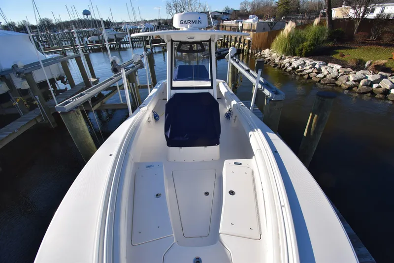 Slide: The Image of 2022 Regulator 25FS boat docked at marina, featuring Garmin navigation system. - 20