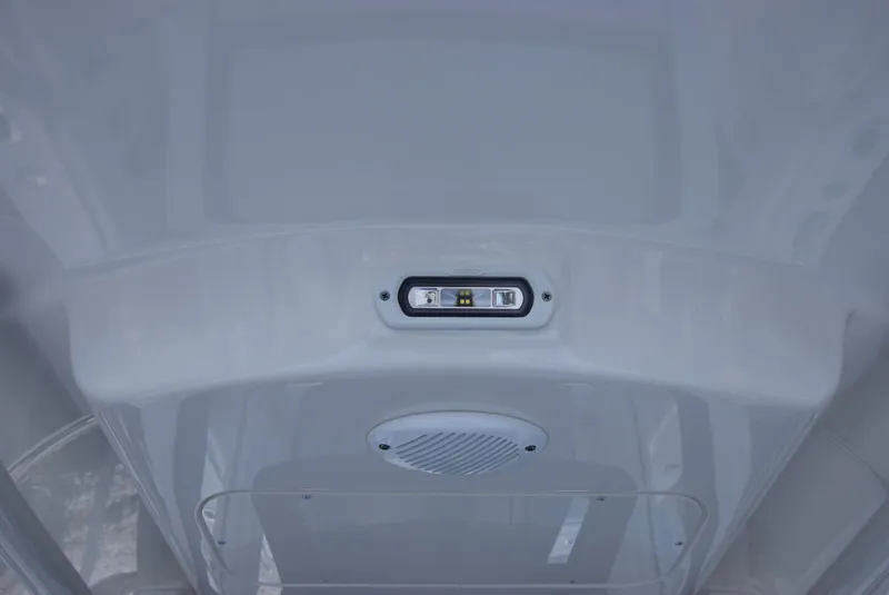 Slide: The Image of 2022 Regulator 25FS boat interior ceiling with light and speaker. - 23