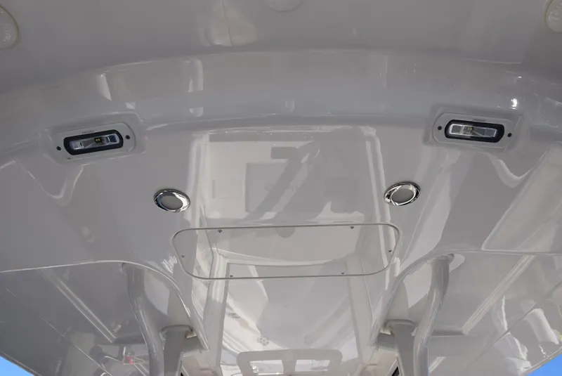 Slide: The Image of 2022 Regulator 25FS boat ceiling with integrated lights and speakers. - 29