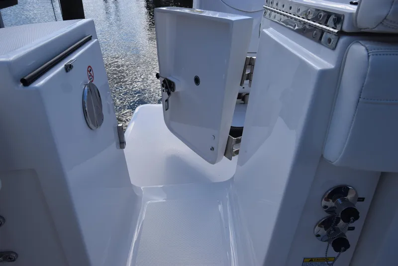 Slide: The Image of 2022 Regulator 25FS boat interior with open hatch and control panel. - 34
