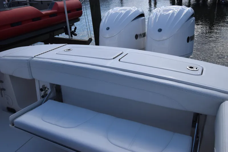 Slide: The Image of 2022 Regulator 25FS boat with dual Yamaha engines and white seating. - 35
