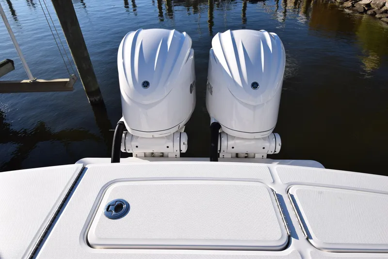 Slide: The Image of 2022 Regulator 25FS boat with dual outboard engines on water. - 37