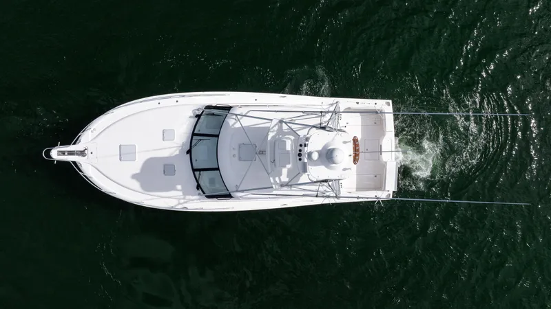Slide: The Image of Aerial view of 2012 Cabo 44 HTX yacht cruising on water. - 10