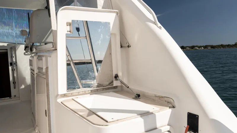 Slide: The Image of Cabo 44 HTX 2012 yacht interior with open door and ocean view. - 13
