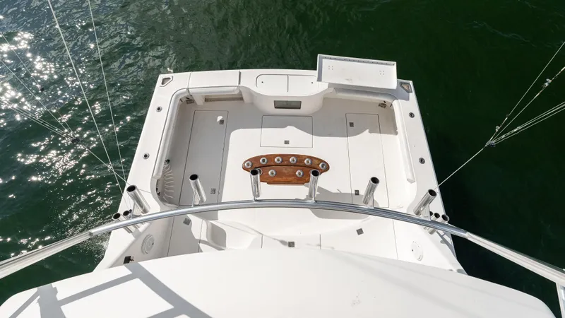 Slide: The Image of Aerial view of 2012 Cabo 44 HTX yacht deck on water. - 14