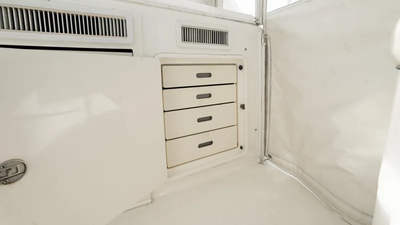 Slide: The Image of Interior storage drawers on a 2012 Cabo 44 HTX boat. - 15