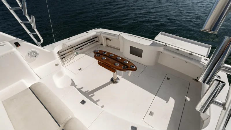 Slide: The Image of Spacious deck of 2012 Cabo 44 HTX yacht with seating and rod holders. - 20