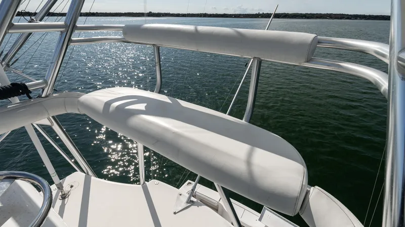 Slide: The Image of Cabo 44 HTX 2012 boat deck with cushioned seating overlooking water. - 23