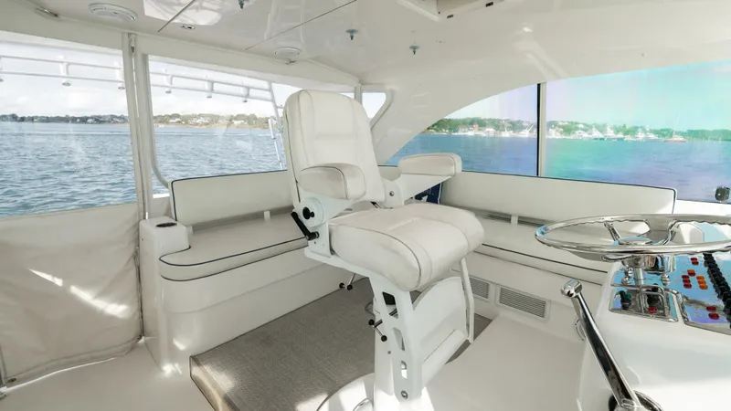 Slide: The Image of Luxurious interior of 2012 Cabo 44 HTX yacht with plush seating and panoramic views. - 29