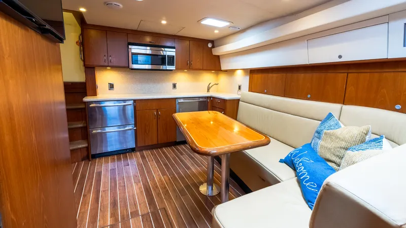 Slide: The Image of Luxurious interior of 2012 Cabo 44 HTX yacht with modern kitchen and cozy seating area. - 37