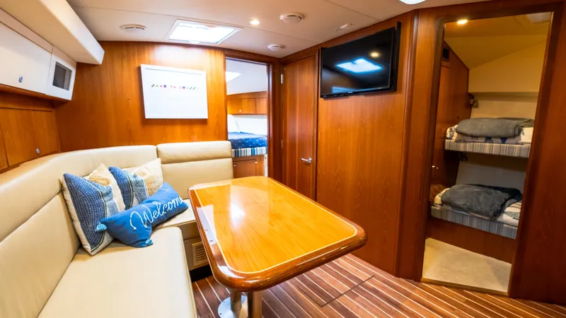 Slide: The Image of Luxurious interior of 2012 Cabo 44 HTX yacht with cozy seating and modern amenities. - 39