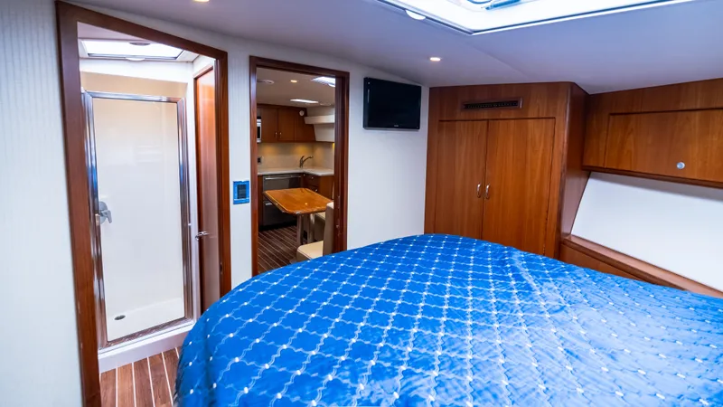 Slide: The Image of Luxurious interior of 2012 Cabo 44 HTX yacht with bedroom and ensuite bathroom. - 45