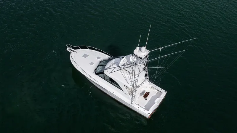 Slide: The Image of Aerial view of 2012 Cabo 44 HTX yacht on calm water. - 9