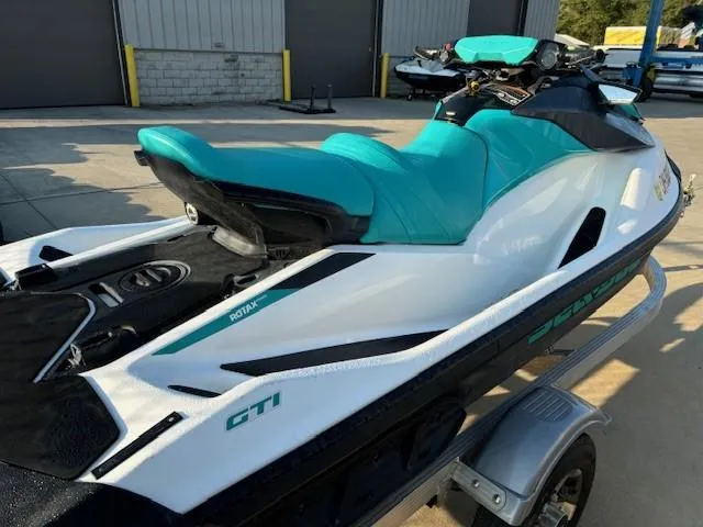 Slide: The Image of 2021 Sea-Doo GTI 90 jet ski with teal seat on a trailer. - 4