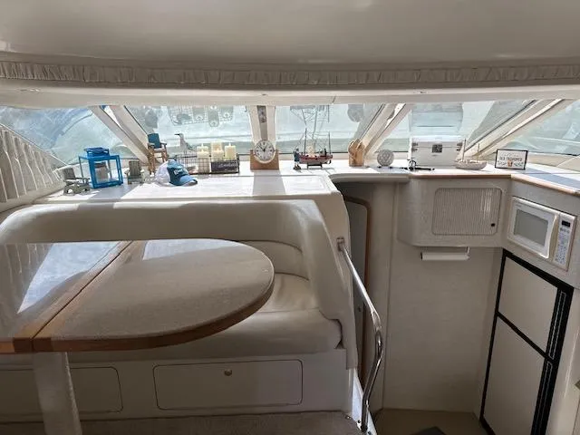 Slide: The Image of Interior of 1997 Sea Ray 400 Sedan Bridge yacht with modern amenities. - 10