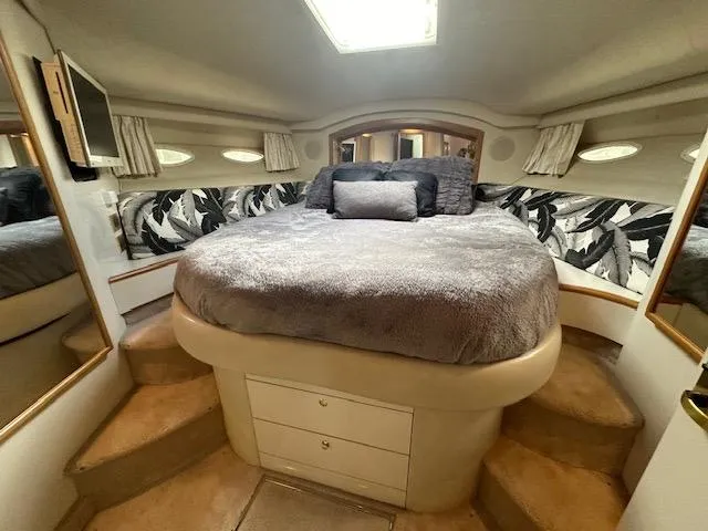 Slide: The Image of Luxurious bedroom interior of 1997 Sea Ray 400 Sedan Bridge yacht. - 13
