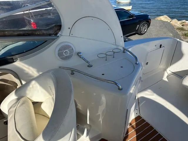 Slide: The Image of 2003 Sea Ray 280 Sundancer boat interior with seating and control panel. - 5