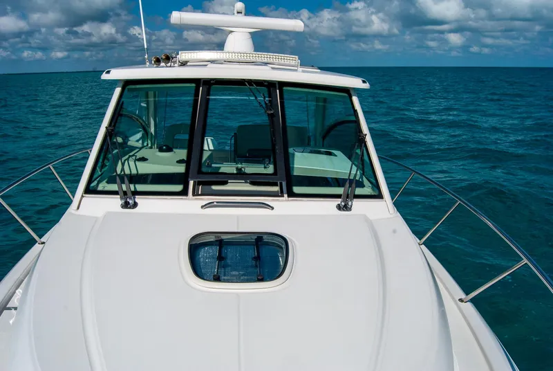 Slide: The Image of 2021 Boston Whaler 345 Conquest boat on open sea under blue sky. - 36