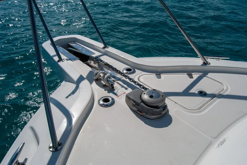 Slide: The Image of 2021 Boston Whaler 345 Conquest bow with anchor system on blue ocean water. - 39