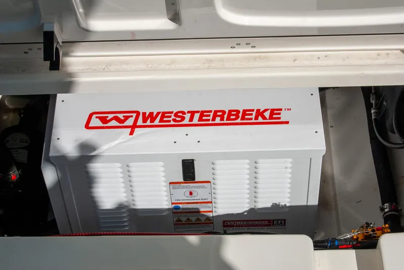 Slide: The Image of Westerbeke generator in a 2021 Boston Whaler 345 Conquest boat engine compartment. - 42
