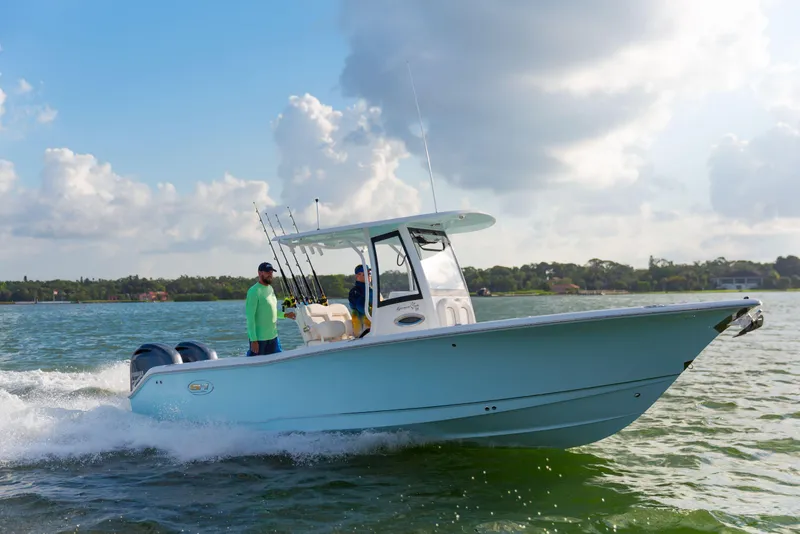 Slide: The Image of 2025 Sea Hunt Gamefish 25 boat cruising on open water under a cloudy sky. - 8